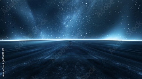 A dark blue sky with a large number of stars. The sky is so dark that it is almost black photo