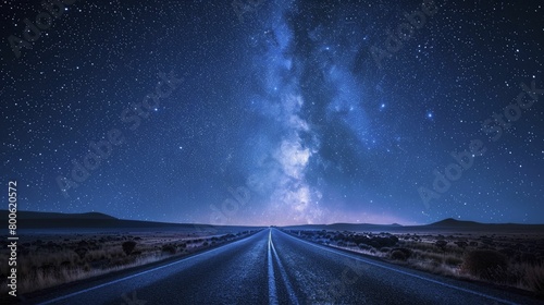 Capturing the essence of ambition and hope, a road disappears into the starry horizon in compelling astrophotography.