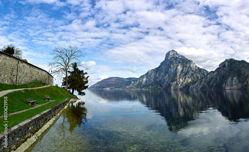 Peaceful spring mountain lake in the Alps. View of Lake Traunsee and Mount Traunstein in background. Upper Austria. photo