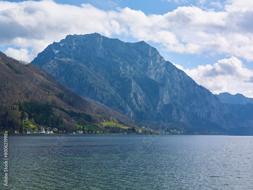 Peaceful spring mountain lake in the Alps. View of Lake Traunsee and Mount Traunstein in background. Upper Austria.