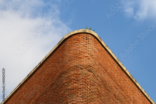 architecture in Barcelona city in Spain, brick wall and blue sky