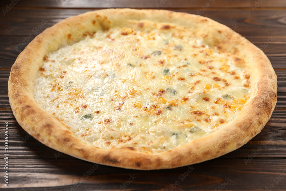 Delicious cheese pizza on wooden table, closeup