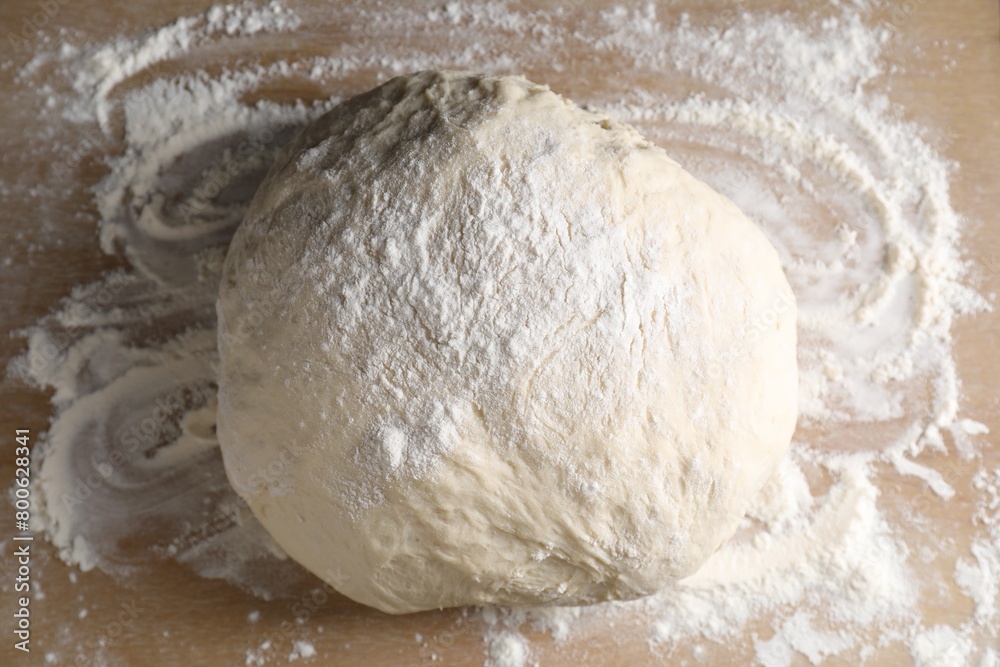 Raw dough on wooden board, top view Raw dough on wooden board, top view