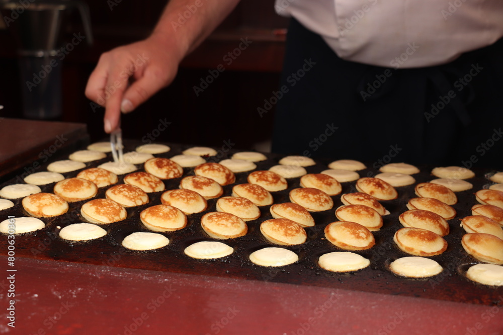 Traditional Dutch Poffertjes, cereal pancakes Traditional Dutch Poffertjes, cereal pancakes