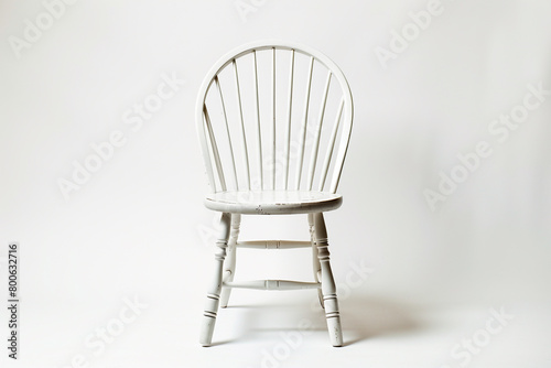 A contemporary setting featuring a Windsor chair on a white background, isolated on solid white background.