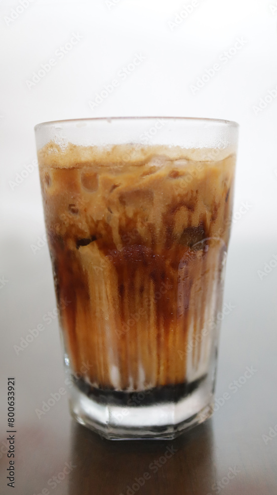 Chilled Ice Coffee Latte in a Clear Tall Glass. Chilled Ice Coffee Latte in a Clear Tall Glass.