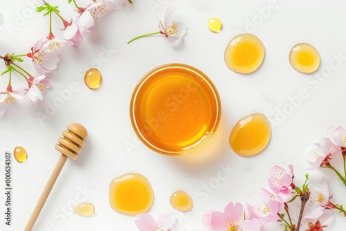 Jar of honey with flowers and wooden spoon. Perfect for food and nature concepts