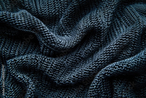 Close up of a cozy blue knitted sweater, perfect for winter fashion projects photo