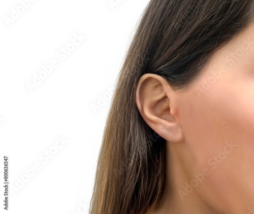 Jewelry mockup ear. A woman with long, brown hair shown from the neck down on a white background, template for earrings and piercings