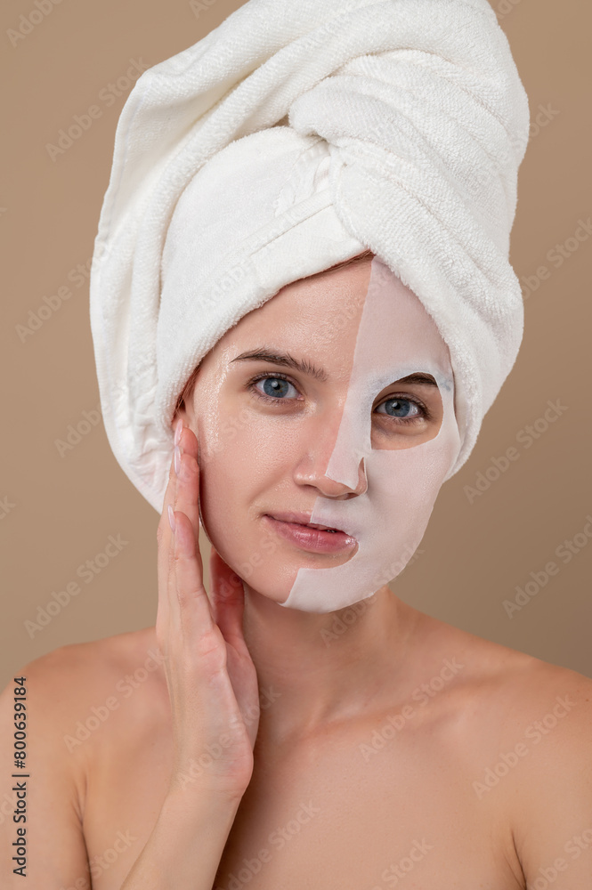 Young woman with rejuvenating mask on face Young woman with rejuvenating mask on face