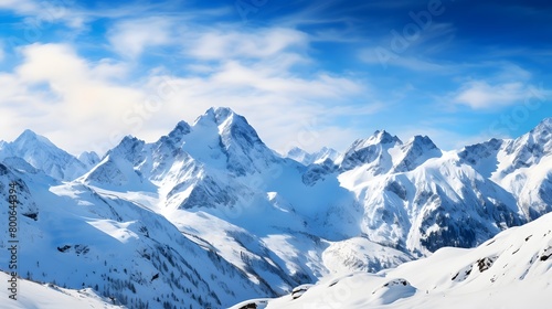 Panoramic view of snowy mountains and blue sky with white clouds © I
