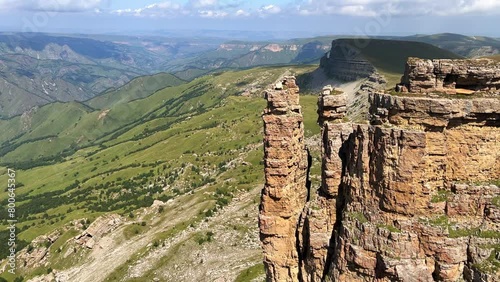 Rocks of two monks, Bermamyt plateau, Karachay-Cherkess Republic. The top of the cliff. Incredible natural epic landscape of the Caucasus, Elbrus region. 4K  photo