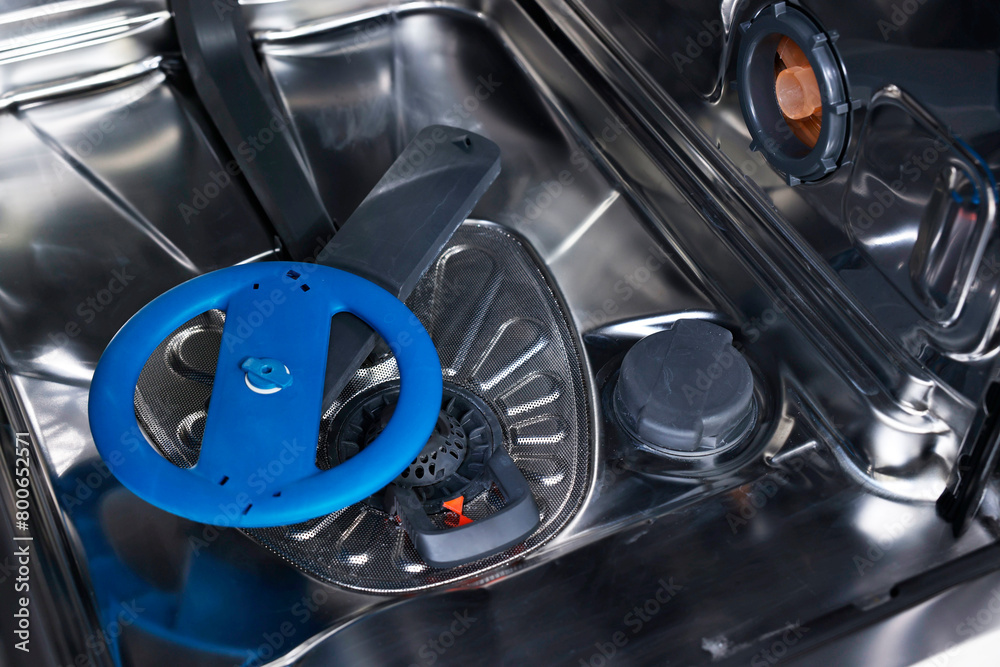 Open clean empty dishwasher, closeup. Home appliance Open clean empty dishwasher, closeup. Home appliance