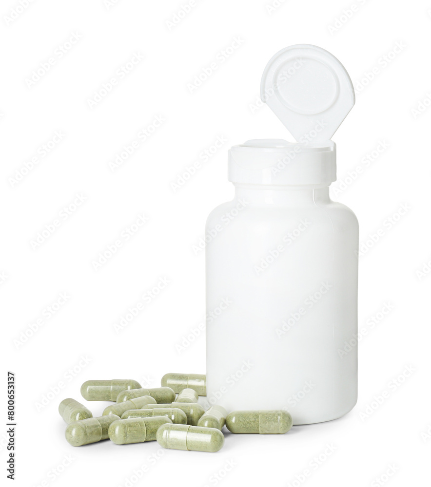 Bottle and pile of vitamin pills isolated on white Bottle and pile of vitamin pills isolated on white