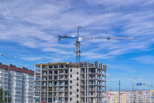 Construction tower crane on a construction site.