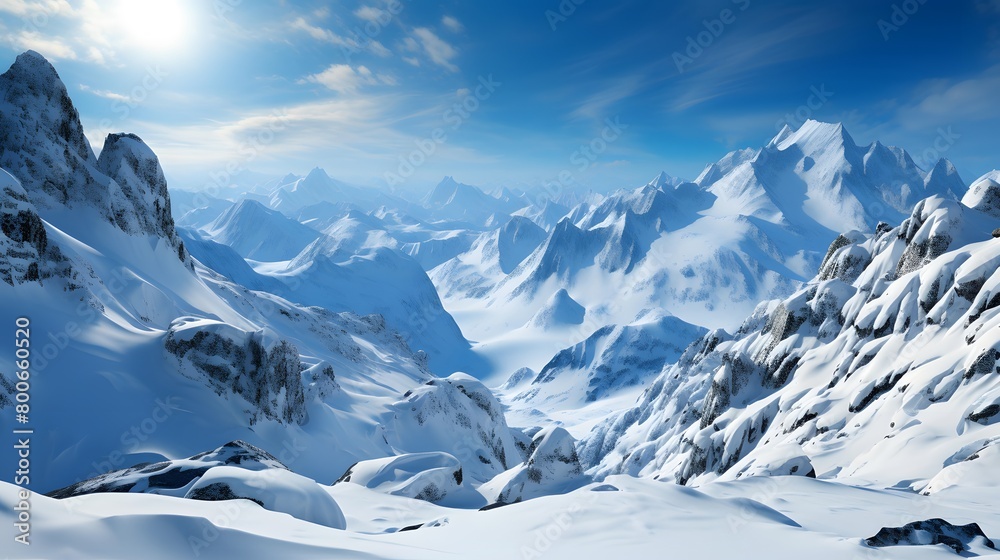 Beautiful winter mountains panorama with snow-capped peaks and blue sky