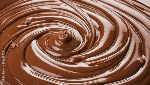 Melted chocolate background. Brown liquid swirls.