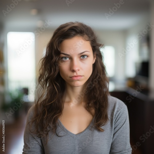 Thoughtful young woman with curly hair