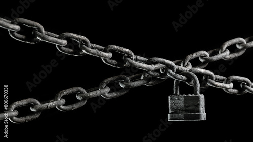 Worn rusted chain and pad lock on black background. Conceptual strength, protection, or security system.