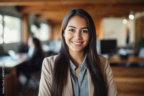 Smiling young professional woman in office