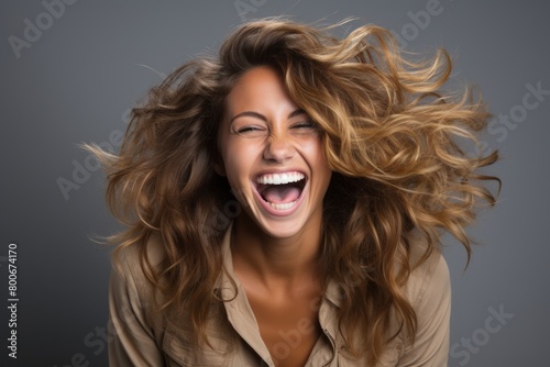 Joyful woman with windblown hair