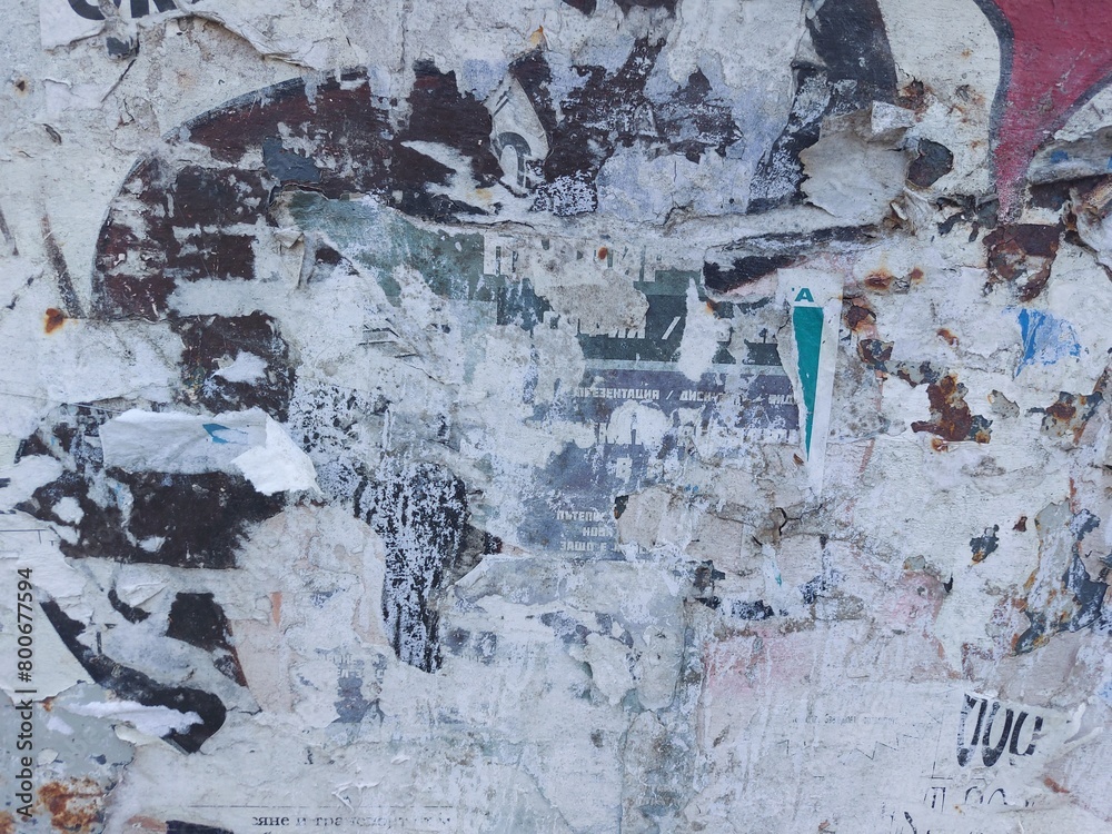Fototapeta premium Torn and ripped street poster background, abstract and messy old paper art collage