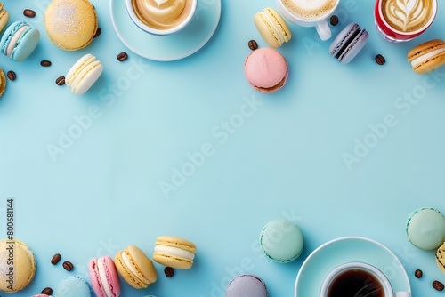 Border made of cups of coffee latte and colorful macarons on blue pastel background.	