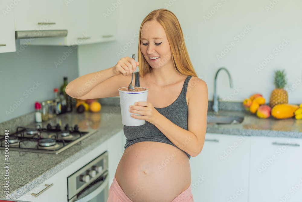 Happy pregnant young woman eating ice cream Happy pregnant young woman eating ice cream