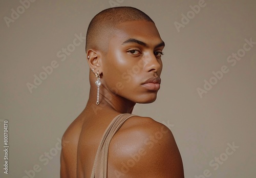 male model with very short hair dressed like a woman photo