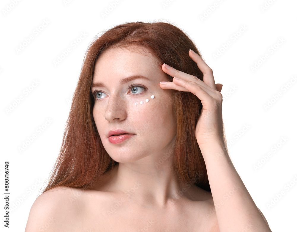 Beautiful woman with freckles and cream on her face against white background Beautiful woman with freckles and cream on her face against white background