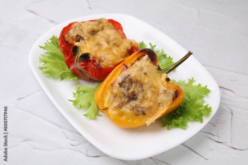 Delicious stuffed peppers on white textured table Delicious stuffed peppers on white textured table