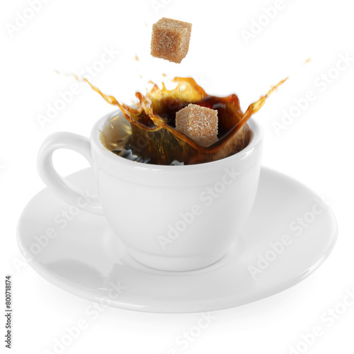 Coffee splashing in cup due to falling sugar cubes on white background