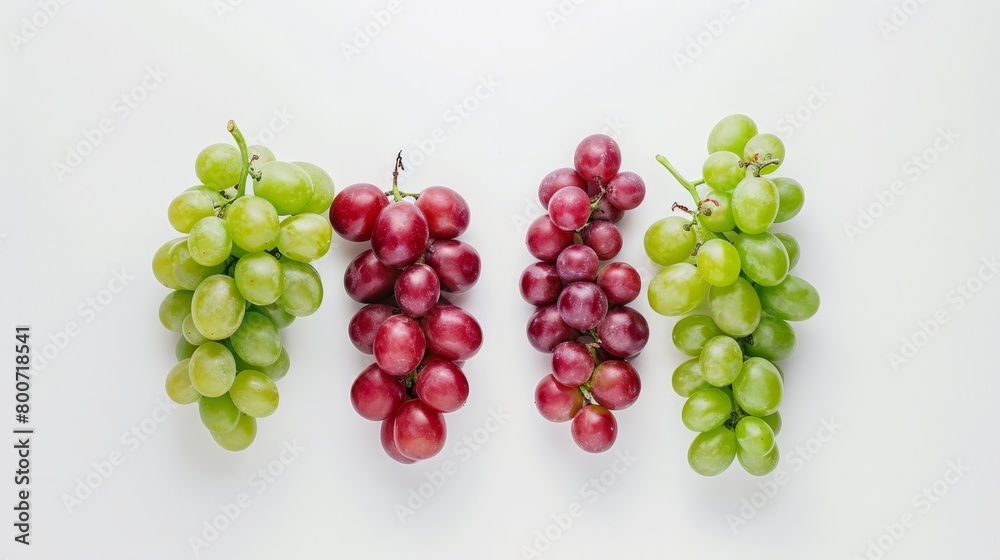 A minimalist composition of red and green grapes on a white background generative ai