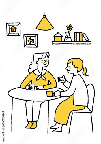 Two women having a lively conversation over drinks.