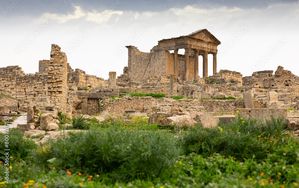 Fototapeta premium View of intact Capitol in archeological site of Dougga in north-west Tunisia