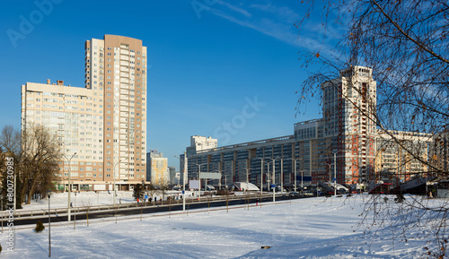 Modern residential area Malinovka and cars on the wide street in the capital Minsk. Republic of Belarus photo