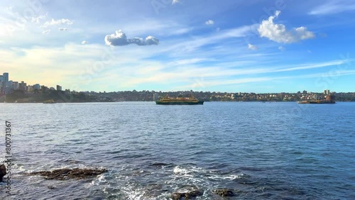 Sydney Harbour forshore viewed from the Gardens in NSW Australia on a nice sunny and partly cloudy afternoon blue skies photo