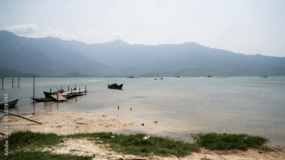 Fishing harbor near mountains in Asia