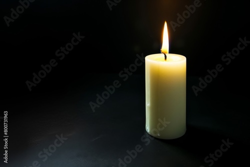 Burning candle on a dark background