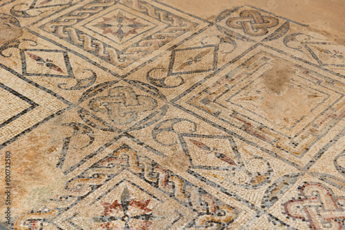 Preserved mosaics of Grand Nymphaeum in Roman settlement of Dougga with traditional geometric designs and motifs. Art of ancient civilizations. Historical archaeological sites in Tunisia