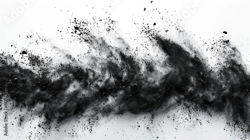 Black chalk fragments and dust particles, creating an exploding effect, isolated on white. photo
