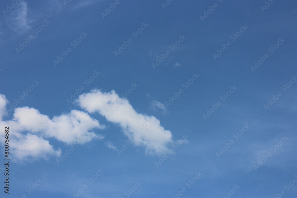 Obraz premium Blue Sky background with tiny Clouds. Panorama background.