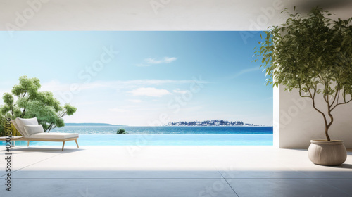A view of the ocean from a balcony with a tree in a planter. The scene is serene and peaceful, with the water and sky creating a calming atmosphere. The tree in the planter adds a touch of greenery