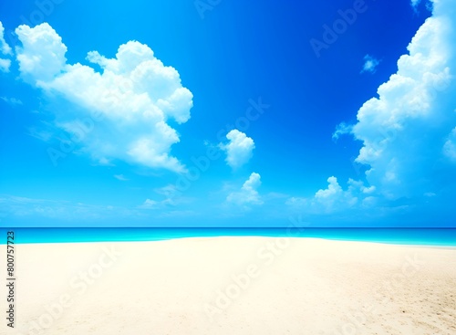 A white sand beach with a beautiful blue sky and a serene view of the vast sea