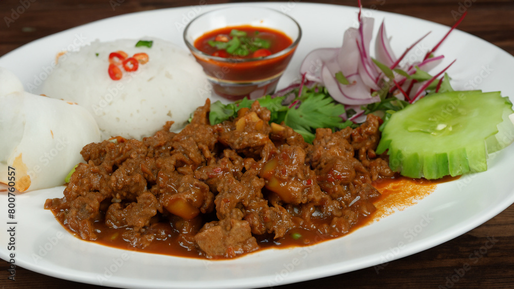 rendang, served with ketupat lebaran, dan sayur labu siam. Generative Ai rendang, served with ketupat lebaran, dan sayur labu siam. Generative Ai