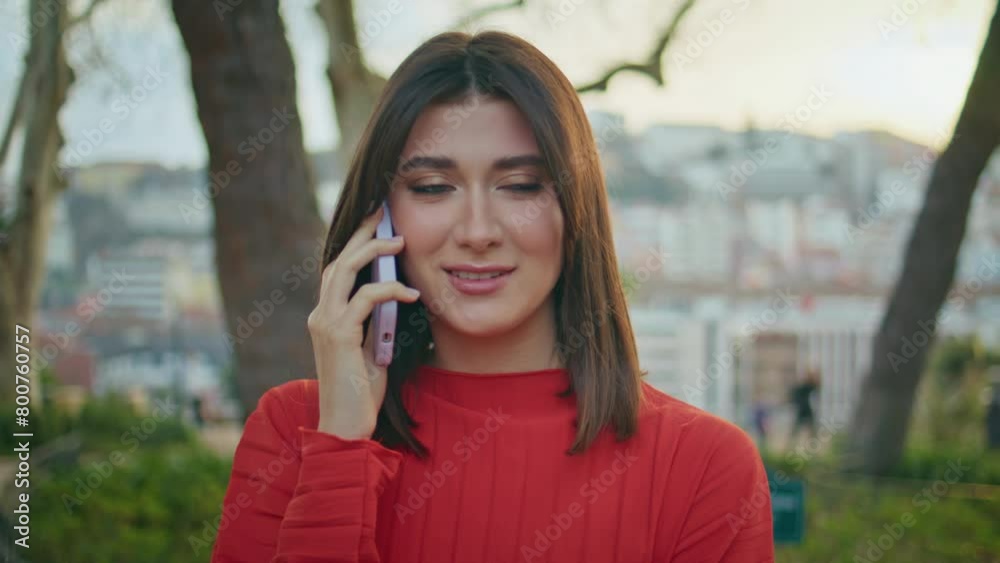 Closeup beautiful woman calling by mobile phone at green nature. Smiling lady Closeup beautiful woman calling by mobile phone at green nature. Smiling lady