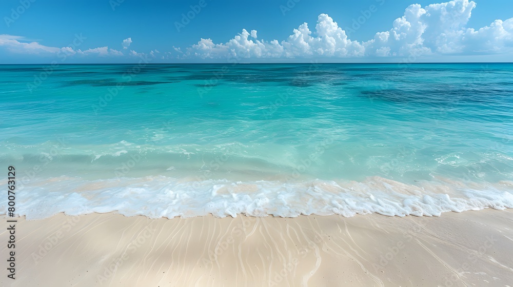 Obraz premium A tranquil paradise features a beautiful beach with sunlit skies and crystal clear blue waters. The white sand complements the shining sun, which creates a sparkling dance of light on the turquoise