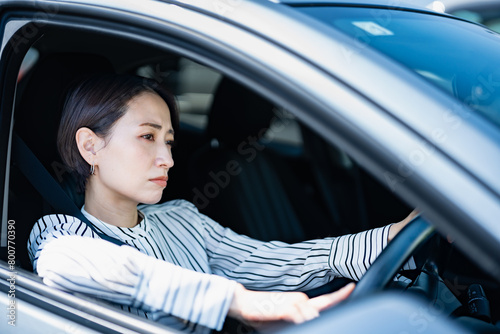 車の運転に憂鬱な女性 photo