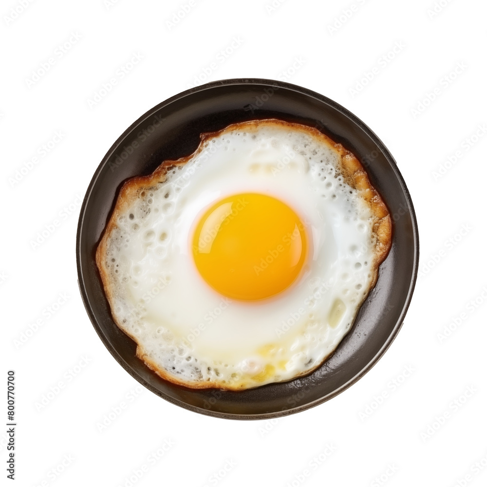 A single sunny-side-up egg in a non-stick frying pan, with crisp edges and a bright yolk, isolated on transparent background. Generative AI