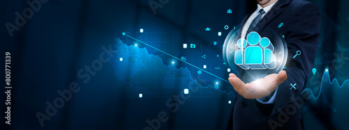 Human Resource: Businessman hand holding virtual Human Resource icon with Technological Icons. Talent Management and Skill Development, Employee Engagement and Performance Tracking. photo